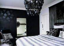 Try slate grey channel tufted walls and silk bedding for a softer take on the classic black and white. Dark And Dramatic Give Your Bedroom A Glam Makeover With Black Accent Wall