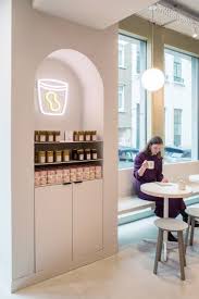 The Other Half Of The Space Nearest To The Window Houses Low Seating Areas And Is Finished In Coffee Shop Interior Design Cafe Interior Design Cafe Interior