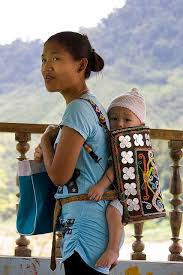 Kayan Or Kenyah Woman With Baby In Traditional Carrier Baby Wearing Mother And Child Mothers Love