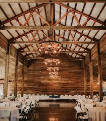 Wagon Wheel Rustic Chandelier Western Decor Pendant Light Etsy In 2021 Log Cabin Wedding Barn Wedding Venue Rustic Wedding Venues