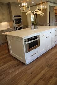 Palmetto Cognac Wood Look Tile Features The Amber Hue Of A Fine Cognac With All Of The Grains Kn Wood Tile Kitchen Wood Tile Floor Kitchen Wood Floor Kitchen