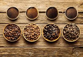 Preparing Fresh Roast Coffee Beans To Brew With An Overhead View Of Four Different Varieties Of Beans With Their Coffee Roasting Gourmet Coffee Coffee Benefits