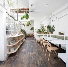 The Interior Is Meant To Reflect The Food And The Culture Of The Restaurant Itself Fresh Bright Tra Cafe Interior Design Restaurant Interior Cafe Interior
