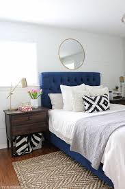 Love This Calming Bedroom Space With The Navy Headboard And Gold Accessories The Inexpensive Mirror Above The Bed Bed Decor Blue Headboard Home Decor Bedroom