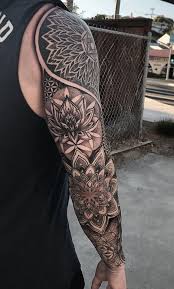 Forearm Tattoo Man Wearing Grey Top Black Jeans Mandala Symbols Geometric Tattoos Men Mandala Tattoo Sleeve Geometric Sleeve Tattoo