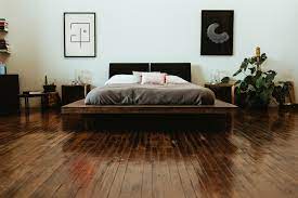Download Premium Image Of Industrial Bedroom With Dark Wooden Floors In 2021 Dark Bedroom Furniture White And Brown Bedroom Dark Wooden Floor
