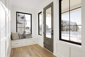 Windowed Entry Hall Extends Front Porch Feel To Interior And Opens To White Panelled Gallery Hall Fairmoun White Paneling Home Builders New Home Construction