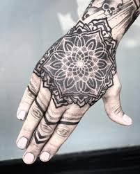 Black Ornamental Mandala Tattoo On The Right Hand Mandala Hand Tattoos Geometric Tattoo Hand Hand Tattoos For Guys