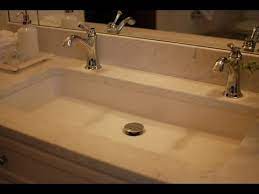 trough bathroom sink with two faucets