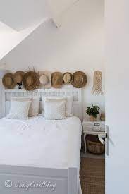 You Ll Love This Guest Bedroom With A Distinctive Bohemian Touch And A Beachy Vibe Straw Hats A Suit Small Guest Bedroom Guest Bedroom Boho Bedroom Furniture