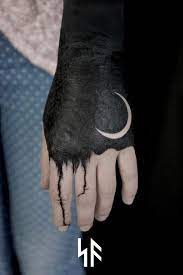 Blackwork Tattoo On Hand Hand Tattoos Solid Black Tattoo Tattoo Designs