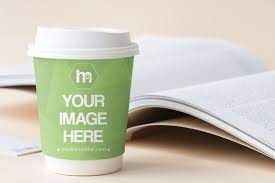 Take A Zip Of Coffee And Keep On Reading A Book An Online Mockup Template Featuring A Plastic Coffee Cup On A Table Next T Plastic Coffee Cups Coffee Cups Cup