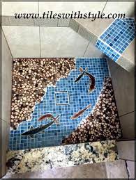 Rose Granite And King Salmon Shaped Mosaic Fish Tiles Were Used In This Shower Floor Design It S A Wo Pebble Tile Shower Shower Tile Pebble Tile Shower Floor