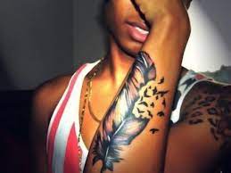 Color Tattoos On Dark Skin Dark Skin Tattoo Skin Color Tattoos Feather Tattoos