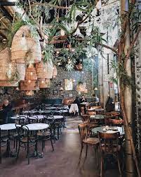 Plant Filled Restaurants Around The World Tips For Decorating With Greenery Bar Design Restaurant Coffee Shop Design Cafe Design