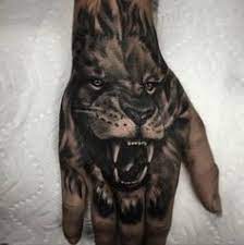 Tattoo Roaring Lion On Hand Http Tattootodesign Com Tattoo Roaring Lion On Hand Tattoo Tattooed Tattoo Hand Tattoos Lion Hand Tattoo Lion Tattoo