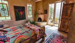 Inside This Santa Fe Desert Pueblo Home Bright Colors Are Painted On A Desert Canvas The Modest Mansion In 2020 Adobe House Santa Fe Style Decor Santa Fe Decor