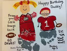 Footprint Georgia Cheerleader And Football Player Baby Footprint Art Baby Art Projects Footprint Art