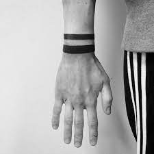 Top 43 Black Band Tattoo Ideas 2021 Inspiration Guide Wrist Tattoos For Guys Band Tattoo Black Band Tattoo