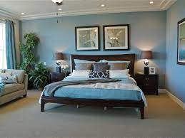 Traditional Blue Bedroom With Dark Wood Furniture And Houseplants Blue Bedroom Dark Bedroom Furniture Master Bedroom Furniture