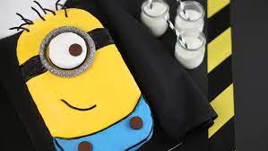 Easy to follow instructions to make a minion trim the tops off three of your cakes so they are flat and about equal depth and trim around the edges of roll out your yellow fondant and cut a rectangle long enough to go round your cake. Minion Sheet Cake Bettycrocker Com