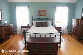Located On Wassergrass Rd Master Bed Featuring Dark Wood Furniture With Light Wood Flooring Black Cheap Hardwood Floors Dark Wood Furniture Light Wood Floors
