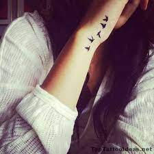 Best Tiny Tattoo Idea Birds Leaving Her Wrist Tattoo Idea Top Tattoo Ideas Tiny Bird Tattoos Bird Tattoo Wrist Bird Tattoos For Women