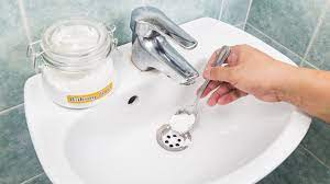 to unclog a drain without calling a plumber