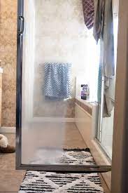 Replace the spray bottle top, and clean stains from shower doors or windows with the vinegar solution until the area is soaked. How To Remove Hard Water Stains From Glass Shower Doors The Forked Spoon
