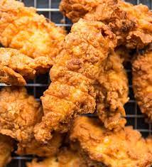 These Spicy Chicken Tenders Are Ridiculously Delicious Chicken Strips Marinated In Buttermilk Spicy Fried Chicken Fried Chicken Tenders Spicy Chicken Tenders