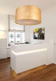 office reception gold in practice lamp m e overpowered ophthalmologist arztpraxis design studio einrichten moderne burogestaltung