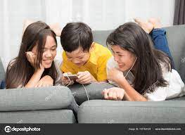 Asian family, boy and girls playing together at home Stock Photo by  ©Surabky 157764124