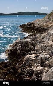 Rocky beach at famous nudist resort Koversada, Croatia Stock Photo - Alamy