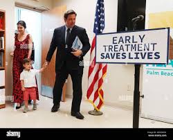 Florida Gov. Ron DeSantis, his wife, Casey, and their son Mason, arrive for  a news conference in West Palm Beach, Fla., on Sept. 2, 2021. DeSantis, a  father of three, described himself