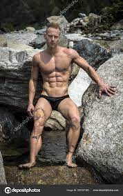 Handsome Young Muscle Man Water Pond Rock Naked Wearing Only Stock Photo by  ©YAYImages 261097300