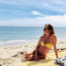 Cat Deeley Shows Off Growing Baby Bump in Tiny Yellow Bikini