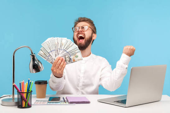 Person working on laptop making money online