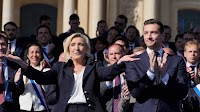 Le Pen supporters rally in Paris, turning a protest into a populist show of force