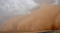 Dust storm reduces visibility on Airport Road, Desert Highway