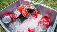 Coca-Cola says it will use U.S. cane sugar in a new Coke, a plan pushed by Trump
