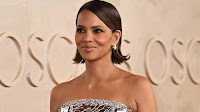Halle Berry's flippy bob hair style at the Oscars 2025 is showing a radiant smile