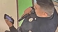Uvalde officer checks phone during Texas school shooting