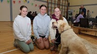 Photos show Kerry families and their canine companions at fundraising event for service dog charity