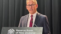 New Zealand cuts rates 25 bps, flags slightly deeper easing cycle as global risks mount