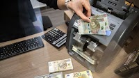 Poland's Zloty (USD/PLN) Surges to 10-Year High Fanned by Hawkish Central Bank