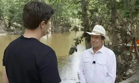 Trapped by floodwater, camp director called to say she 'can't get out'