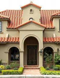Red Tile Roof And A Brown Door