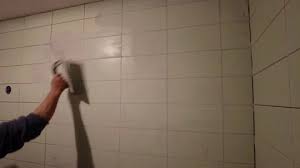 Builder Grouting Ceramic Tiles On