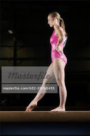 female gymnast beginning routine on