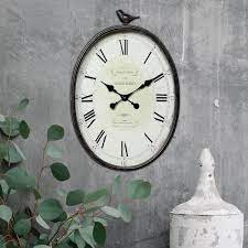 Metal Oval Wall Clock With Bird